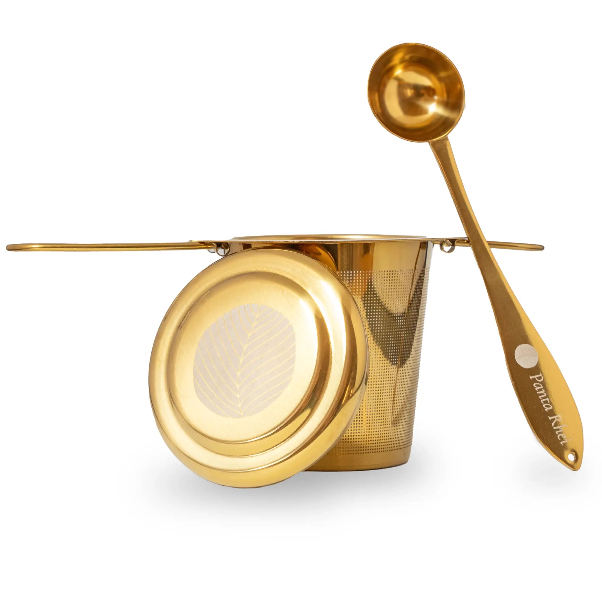 Teesieb und Teelöffel in gold